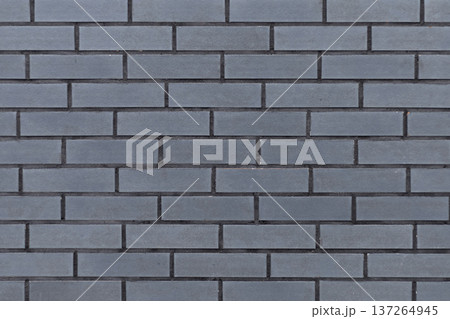 Textured grey surface resembling brick masonry, industrial style backdrop 137264945