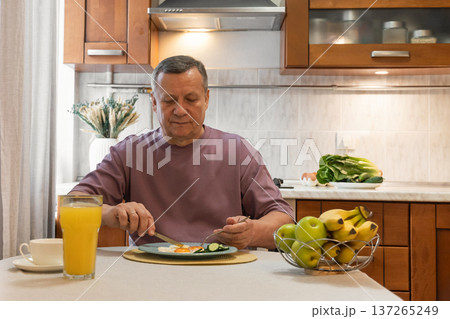 Man having breakfast at home Man having breakfast at home 137265249