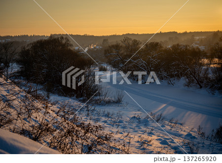 Winter Twilight: Snowy Landscape at Sunset 137265920