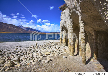 Crowley Lake Stone Columns and Sierra Nevada Mountains Beside Blue Water in Sunlight Crowley Lake Stone Columns and Sierra Nevada Mountains Beside Blue Water in Sunlight 137268341