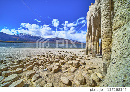 Crowley Lake Stone Columns with Rocky Shore and Snow Capped Sierra Mountains 137268345