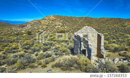Abandoned Stone Ruin Desert Landscape and White Mountain California Aerial 137268353