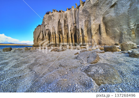 Crowley Lake Stone Columns and Rocky Shoreline under Vibrant Blue Sky California Crowley Lake Stone Columns and Rocky Shoreline under Vibrant Blue Sky California 137268496