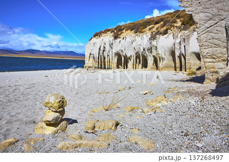 Crowley Lake Stone Columns With Rock Cairn and Lake Shore Under Bright Blue Sky Crowley Lake Stone Columns With Rock Cairn and Lake Shore Under Bright Blue Sky 137268497