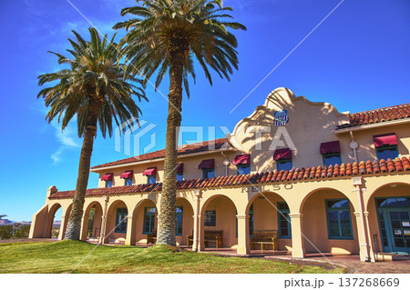 Kelso Visitors Center Palm Trees and Spanish Revival Architecture in Bright Mojave Sun Kelso Visitors Center Palm Trees and Spanish Revival Architecture in Bright Mojave Sun 137268669