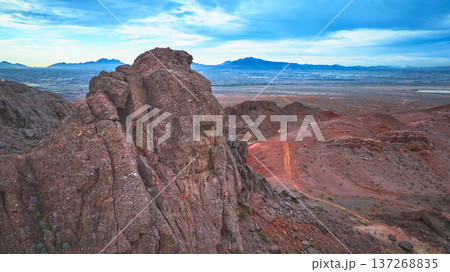 Aerial Lava Butte Red Desert Terrain and Distant Las Vegas Cityscape Aerial Lava Butte Red Desert Terrain and Distant Las Vegas Cityscape 137268835