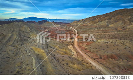 Aerial Nevada Desert Road and Rugged Hills Near Las Vegas at Sunset Aerial Nevada Desert Road and Rugged Hills Near Las Vegas at Sunset 137268838