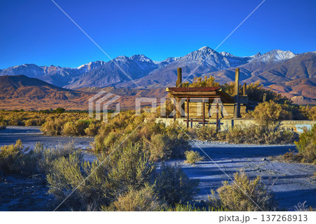 Abandoned Structure in Owens Valley with Snow Capped Sierra Nevada Mountains 137268913