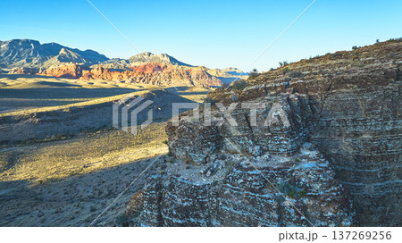 Aerial Cowboy Canyon Rock Formations and Mountain Landscape at Golden Hour 137269256