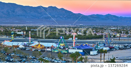 Aerial Las Vegas Fairground Carnival Rides and Mountain Panorama at Golden Hour 137269284