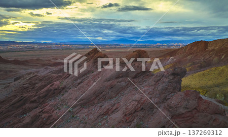 Aerial Red Rock Formations and Desert Landscape With Las Vegas Skyline at Dusk 137269312