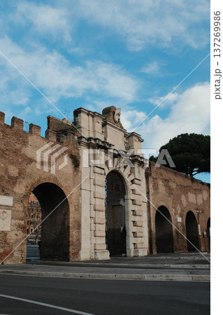 Archbasilica of Saint John Lateran facade and Lateran district with piazza palace and Porta San Giovanni ancient walls Rome Italy exterior architecture landmark. High quality photo 137269986