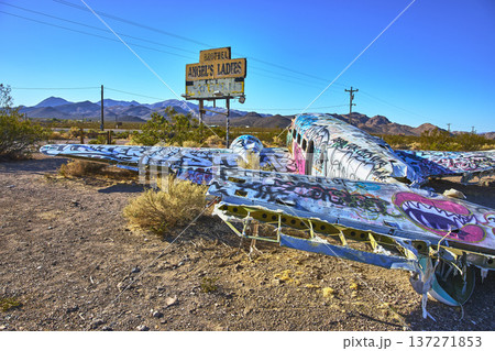 Graffiti Covered Abandoned Airplane in Nevada Desert Near Beatty with Roadside Sign Graffiti Covered Abandoned Airplane in Nevada Desert Near Beatty with Roadside Sign 137271853
