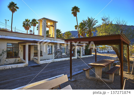 Ghost Town Building with Sunburst Palm Trees and Picnic Table in Mojave California 137271874