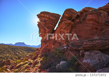 Red Rock Canyon Guardian Angel Rock Formation with Sunburst and Desert Landscape Red Rock Canyon Guardian Angel Rock Formation with Sunburst and Desert Landscape 137271972