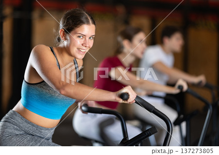 Woman in the top is engaged in an airbike 137273805
