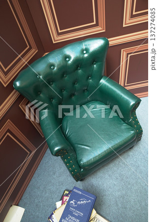 July 4 2025 Green Leather Armchair in Classic Study with Books Around 137274085
