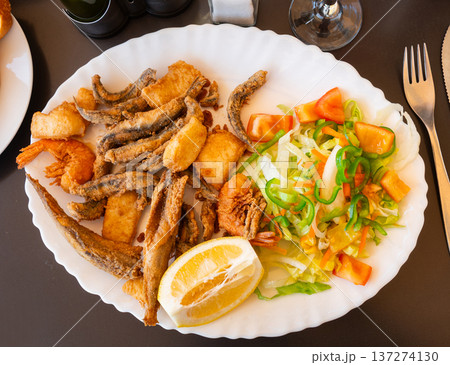 Grilled seafood and fish are specialty at coastal restaurant Grilled seafood and fish are specialty at coastal restaurant 137274130