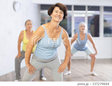 Group of elderly woman dancing in fitness studio Group of elderly woman dancing in fitness studio 137274684