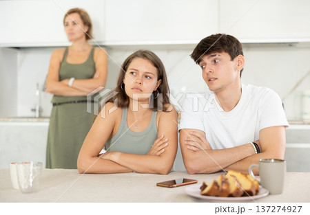 Mom make claims to couple in home kitchen 137274927