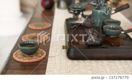 Tea drinking tradition. Chinese ceremony. Prepared fresh beverage figurine spiritual vapor aromatherapy for meditation ritual enlightenment. 137276770
