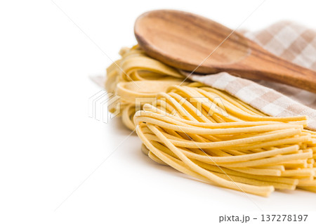 Fresh pasta ready for cooking, showing strands of bigoli set on a white background 137278197