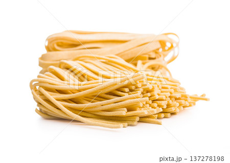 Fresh pasta ready for cooking, showing strands of bigoli set on a white background Fresh pasta ready for cooking, showing strands of bigoli set on a white background 137278198
