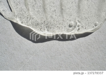 Clear cosmetic gel with bubbles showing texture on light grey background Clear cosmetic gel with bubbles showing texture on light grey background 137278337