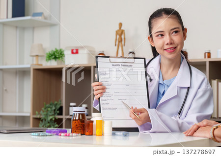 Healthcare professional explaining health summary to patient 137278697