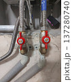 Red water supply valves to the gas heating boiler and from. High quality photo 137280740