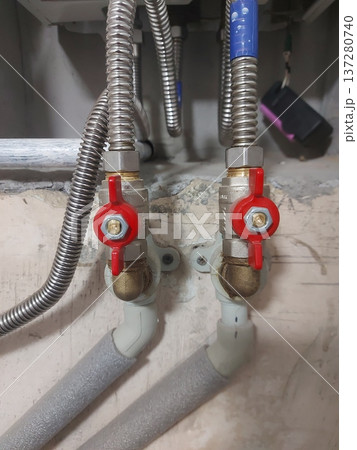 Red water supply valves to the gas heating boiler and from. High quality photo 137280740