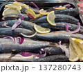 Herring with red onion rings and lemon.  137280743