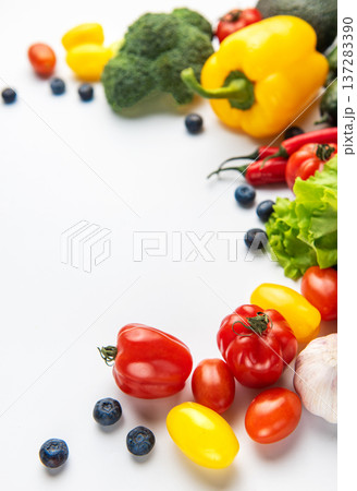 Fresh organic vegetables and fruit border on white 137283390