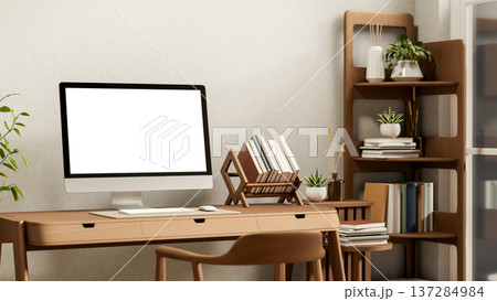 White screen computer and book rack on wooden table and chair aside display shelf in white wall room 137284984