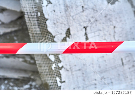 Building waste fenced red tape.Old insulation material from walls Building waste fenced red tape.Old insulation material from walls 137285187