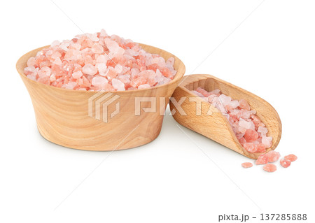 Pink Himalayan salt in wooden bowl isolated on white background. Pink Himalayan salt in wooden bowl isolated on white background. 137285888