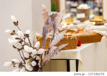 Decorative flowers near buffet table 137286259