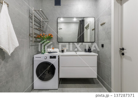 Modern Bathroom Interior with Washing Machine and Large Mirror Modern Bathroom Interior with Washing Machine and Large Mirror 137287371