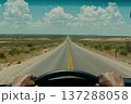 Driver's Perspective Looking Out Onto an Endless Open Road Under Blue Skies 137288058