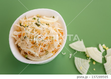 fresh cabbage salad with onion in white bowl fresh cabbage salad with onion in white bowl 137289505