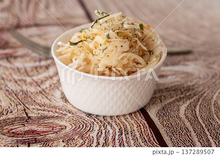 fresh shredded cabbage salad in white bowl fresh shredded cabbage salad in white bowl 137289507