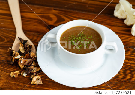 rustic homemade mushroom soup served with dried mushrooms rustic homemade mushroom soup served with dried mushrooms 137289521