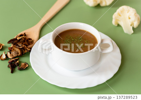 homemade mushroom soup with dried mushrooms garnish 137289523