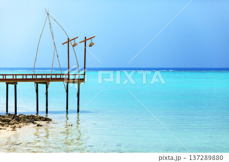 Clear blue water meets calm sky Clear blue water meets calm sky 137289880