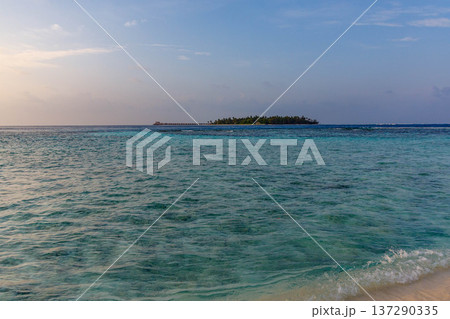Crystal waters ripple toward a distant island Crystal waters ripple toward a distant island 137290335
