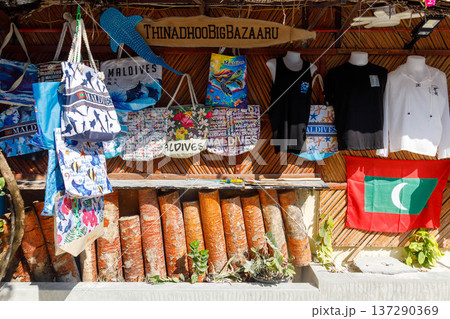 Colorful bags hang beside woven baskets Colorful bags hang beside woven baskets 137290369