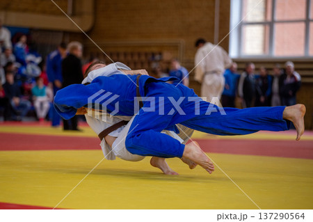 Judo athletes during indoor competition 137290564