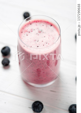 Two glasses of berry smoothie with chia and fresh berries 137290688