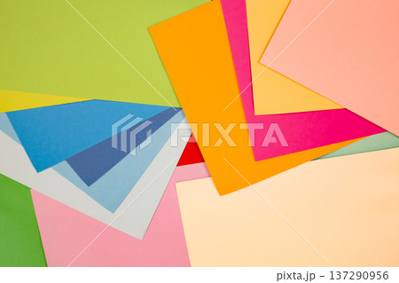 sheets of colored paper. Many colored sheets of paper are laid out in the harsh composition. background of colored paper. 137290956