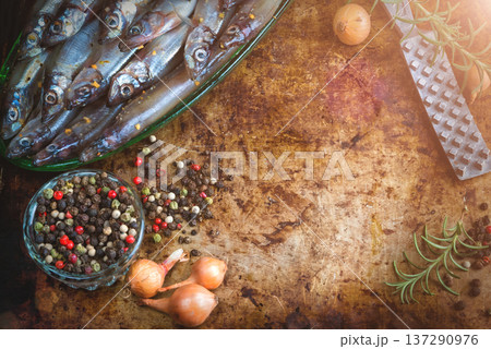 Fresh fish top view. Spicy herb and vegetables. Spice on wooden board. Healthy food cooking. Fresh fish top view. Spicy herb and vegetables. Spice on wooden board. Healthy food cooking. 137290976